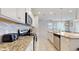 Modern kitchen with granite countertops and stainless steel appliances at 8900 Sydney Ave, Kissimmee, FL 34747