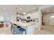 Modern kitchen with granite countertops, stainless steel appliances, and a breakfast bar at 8900 Sydney Ave, Kissimmee, FL 34747