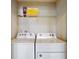 Bright laundry room with modern machines and ample storage space at 8900 Sydney Ave, Kissimmee, FL 34747