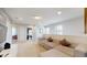 Upstairs living room with comfortable sectional sofa and ample natural light at 8900 Sydney Ave, Kissimmee, FL 34747