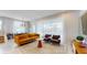 Bright living room area with dining, featuring stylish furniture and large windows at 8900 Sydney Ave, Kissimmee, FL 34747