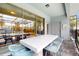 Covered patio features a dining table and chairs with an open view into the home at 8900 Sydney Ave, Kissimmee, FL 34747