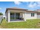 Covered porch features a tiled floor, recessed lighting, and outdoor seating, perfect for relaxing at 914 Fallon Hills Dr, Haines City, FL 33844