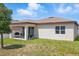 The spacious backyard features a covered patio at 914 Fallon Hills Dr, Haines City, FL 33844