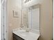 This bathroom has a large mirror over a white single sink vanity at 914 Fallon Hills Dr, Haines City, FL 33844