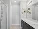 Bathroom featuring a modern shower and double vanity with countertop space at 914 Fallon Hills Dr, Haines City, FL 33844