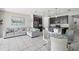 Bright, open living space with a modern kitchen and comfortable seating area at 914 Fallon Hills Dr, Haines City, FL 33844