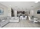 Cozy living area with a plush sectional sofa, open to the stylish kitchen at 914 Fallon Hills Dr, Haines City, FL 33844