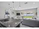 Spacious living area with sliding glass doors and a kitchen with dark cabinets at 914 Fallon Hills Dr, Haines City, FL 33844