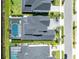Aerial view of rooftop of luxury home with screened-in backyard swimming pool at 9352 Santorini Dr, Orlando, FL 32827