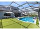 Beautiful pool and putting green with screened enclosure and comfortable seating at 9352 Santorini Dr, Orlando, FL 32827