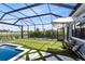 Amazing outdoor space featuring a pool, putting green, and shaded seating area at 9352 Santorini Dr, Orlando, FL 32827