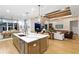 Spacious kitchen with a center island, seating, and stainless steel appliances at 9352 Santorini Dr, Orlando, FL 32827