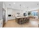 Modern kitchen featuring a large island, stainless steel appliances, and ample cabinet space at 9352 Santorini Dr, Orlando, FL 32827