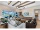 Comfortable living room with wood beams, stone accent wall, and a modern entertainment center at 9352 Santorini Dr, Orlando, FL 32827