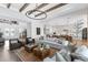 Bright open-concept living room with exposed beams and seamlessly connected kitchen at 9352 Santorini Dr, Orlando, FL 32827