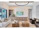 Bright living room with stone accent wall, modern entertainment center, and natural light at 9352 Santorini Dr, Orlando, FL 32827