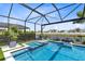 Sparkling pool and spa with lush landscaping in screened-in backyard at 9352 Santorini Dr, Orlando, FL 32827