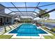 Beautiful pool with spa, fire pit, and tropical plants at 9352 Santorini Dr, Orlando, FL 32827