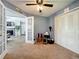 Bonus room with carpet, double door closet, and view into the living room at 950 Bird Bay Ct # 206, Lake Mary, FL 32746