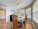 The dining room features wood floors, bright windows, and a ceiling fan at 950 Bird Bay Ct # 206, Lake Mary, FL 32746