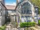 Charming two-story condo featuring a large arched window and blue trim details at 950 Bird Bay Ct # 206, Lake Mary, FL 32746