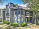A two-story home features blue trim, large windows, and a balcony at 950 Bird Bay Ct # 206, Lake Mary, FL 32746