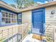 A bright blue front door with sidelight and unit number 206 is shown at 950 Bird Bay Ct # 206, Lake Mary, FL 32746