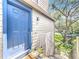 This condo features a bright blue front door and staircase leading to unit 206 at 950 Bird Bay Ct # 206, Lake Mary, FL 32746