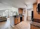 Updated kitchen features granite counters, wood cabinets and opens to living room and eat in kitchen area at 950 Bird Bay Ct # 206, Lake Mary, FL 32746