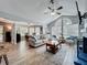 Bright living room with vaulted ceilings, hardwood floors, and a blue-tiled fireplace at 950 Bird Bay Ct # 206, Lake Mary, FL 32746