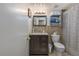 Cozy bathroom with tiled backsplash, storage cabinet, and shower at 1000 S Semoran Blvd # 604, Winter Park, FL 32792