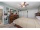 Bedroom with ceiling fan, neutral paint, and closet storage at 1000 S Semoran Blvd # 604, Winter Park, FL 32792