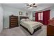 This primary bedroom features a ceiling fan and comfortable furnishings at 1000 S Semoran Blvd # 604, Winter Park, FL 32792