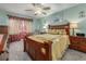 Comfortable bedroom with wooden furniture, matching night stands and lamps at 1000 S Semoran Blvd # 604, Winter Park, FL 32792