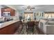 Dining area adjacent to the kitchen with seating for four and decorative rug at 1000 S Semoran Blvd # 604, Winter Park, FL 32792