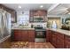 Updated kitchen with stainless steel appliances and wood-look flooring at 1000 S Semoran Blvd # 604, Winter Park, FL 32792