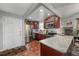 Well-lit kitchen with stainless appliances, granite countertops, and ample cabinet space at 1000 S Semoran Blvd # 604, Winter Park, FL 32792