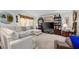 Cozy living room featuring plush seating and plenty of display shelving at 1000 S Semoran Blvd # 604, Winter Park, FL 32792