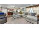 Spacious living room area next to the kitchen featuring a comfy sectional sofa at 1000 S Semoran Blvd # 604, Winter Park, FL 32792