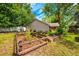 Backyard featuring garden beds, privacy fence, and mature landscaping at 1010 Leinhart Ct, Oviedo, FL 32765