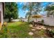 A well-maintained backyard offers a patio set, lush green lawn, and a privacy fence at 1010 Leinhart Ct, Oviedo, FL 32765