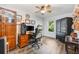 This office/bedroom boasts hardwood floors, a ceiling fan, a large window and a decorative Game of Thrones chair at 1010 Leinhart Ct, Oviedo, FL 32765