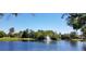 Scenic pond featuring a fountain, surrounded by lush greenery at 1010 Leinhart Ct, Oviedo, FL 32765