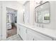 Updated bathroom with dual sinks, white cabinetry, and modern fixtures at 112 E Spruce St, Orlando, FL 32804