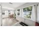 Bright bonus room with windows, a desk, room for exercise and an outside view of the garage at 112 E Spruce St, Orlando, FL 32804