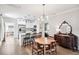Open concept eat-in kitchen boasting a dining table with seating and views into the living room at 112 E Spruce St, Orlando, FL 32804