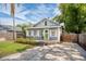 Charming home featuring a green front door, a small porch, and an inviting curb appeal at 112 E Spruce St, Orlando, FL 32804