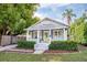 Charming single-story home with a well-manicured lawn, inviting porch, and a vibrant green front door at 112 E Spruce St, Orlando, FL 32804