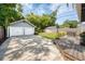Large detached two-car garage with a spacious driveway and outdoor deck in the backyard at 112 E Spruce St, Orlando, FL 32804